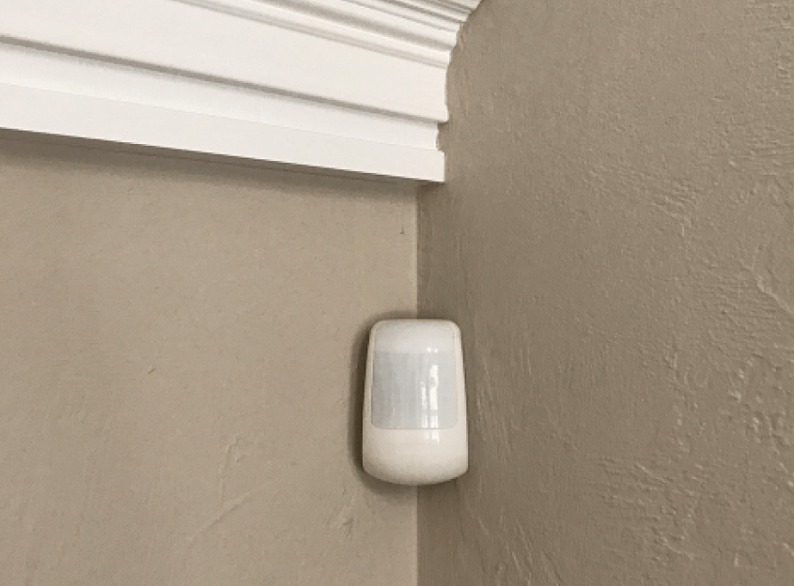 wireless motion detector install on Florida home wall corner