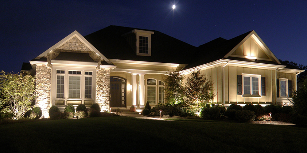 Florida home lit up by outdoor lighting